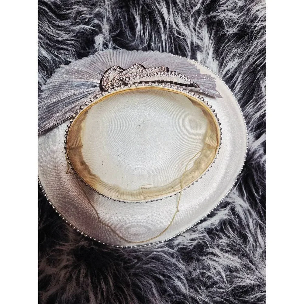 Silver pleated facinator hat